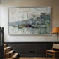 Silver floater framed canvas featuring a harbor view with masts, houses, and reflections in water, displayed in a hallway near a staircase.
