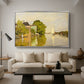 Houses on the Achterzaan, 1871 by Claude Monet as a silver floater framed canvas featuring colorful houses reflected in calm river surrounded by greenery, displayed above a sofa in a modern living room.