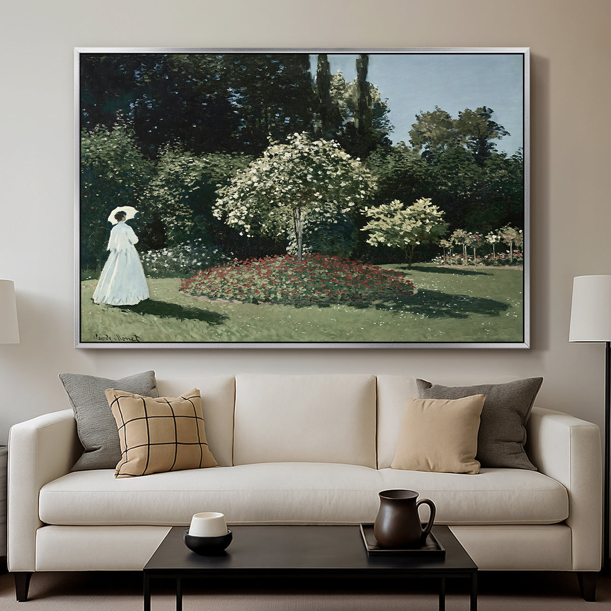 Woman in the Garden, Sainte-Adresse, 1867 by Claude Monet displayed in a silver floater framed canvas above a sofa in a clean living room.