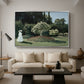 Woman in the Garden, Sainte-Adresse, 1867 by Claude Monet as a silver floater framed canvas featuring a woman standing in garden surrounded by flowers and greenery, displayed above a sofa in a modern living room.