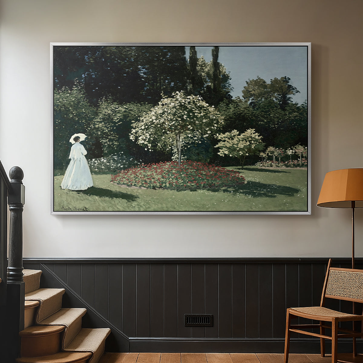 Silver floater framed canvas featuring a tranquil garden portrait with soft natural light, displayed in a hallway near a staircase.