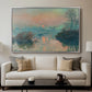 Sunset on the Seine at Lavacourt, Winter Effect, 1880 by Claude Monet displayed in a silver floater framed canvas above a sofa in a clean living room.