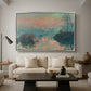 Sunset on the Seine at Lavacourt, Winter Effect, 1880 by Claude Monet as a silver floater framed canvas featuring a glowing sunset over snowy river landscape with soft reflections, displayed above a sofa in a modern living room.