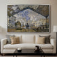 The Gare Saint-Lazare, 1877 by Claude Monet displayed in a silver floater framed canvas above a sofa in a clean living room.