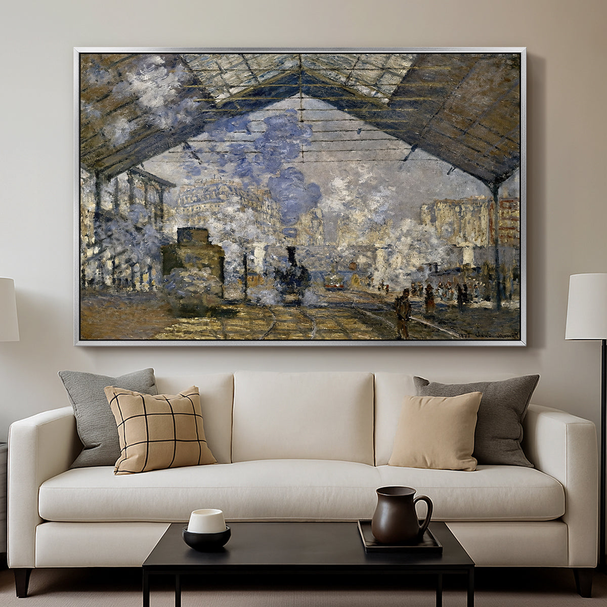 The Gare Saint-Lazare, 1877 by Claude Monet displayed in a silver floater framed canvas above a sofa in a clean living room.