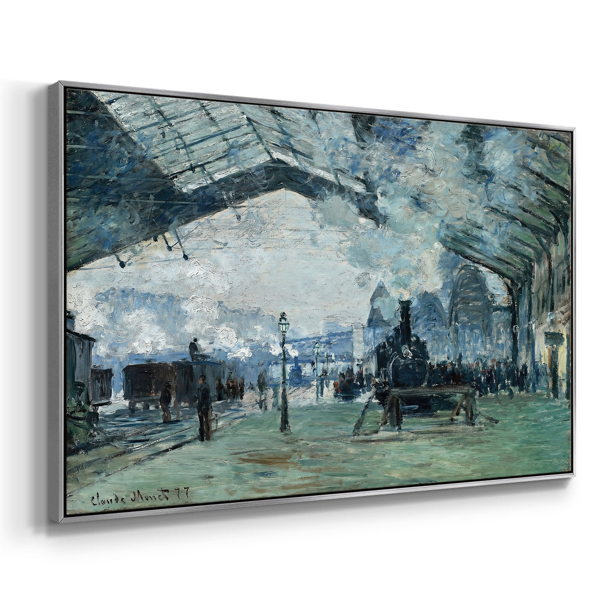 Angled view of The Saint-Lazare Station, 1877 by Claude Monet in a silver floater framed canvas.
