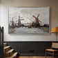 Silver floater framed canvas featuring a landscape featuring windmills and low horizon sky, displayed in a hallway near a staircase.