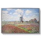 Tulip Fields with the Rijnsburg Windmill, 1886 by Claude Monet in a silver floater framed canvas wall art display.