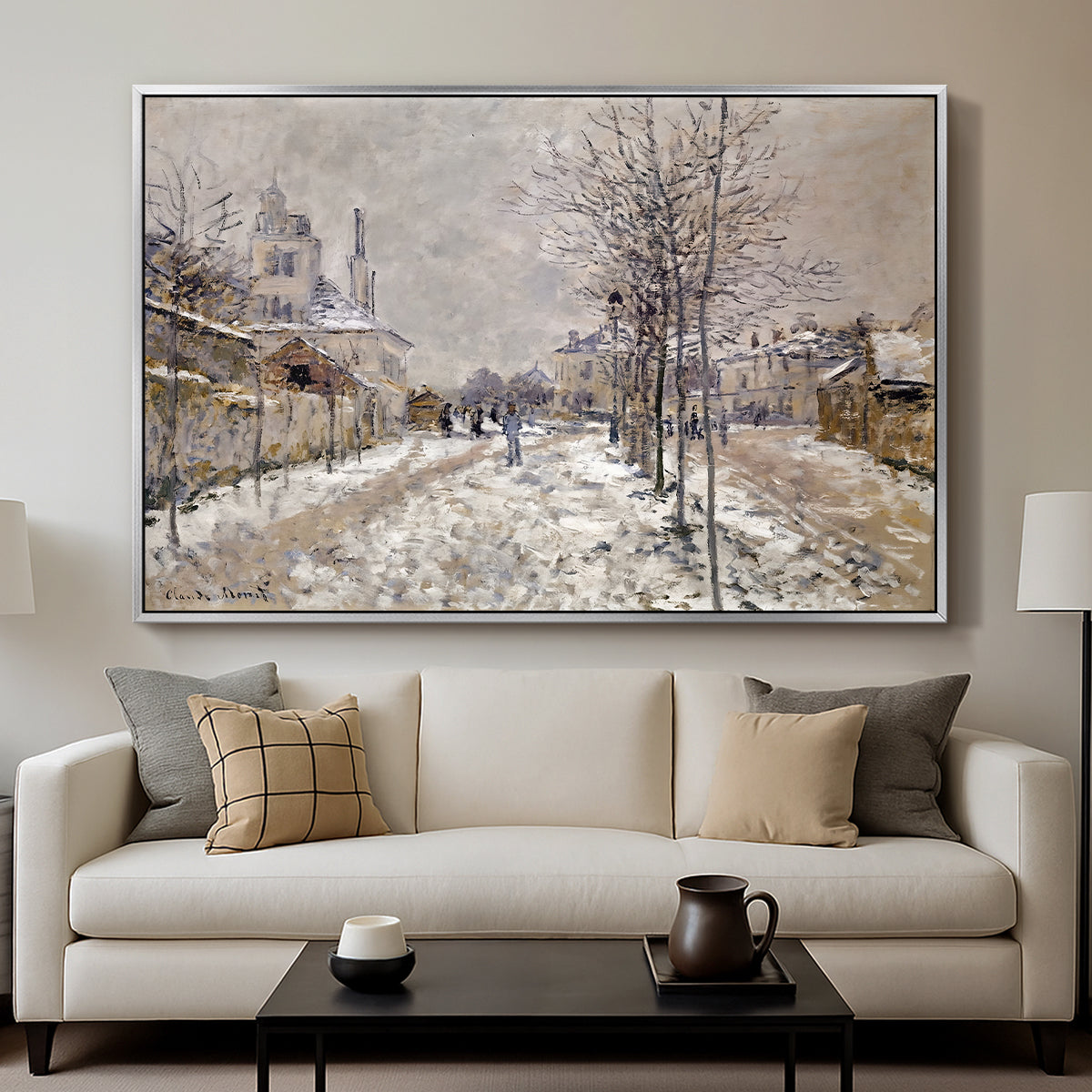 The Boulevard de Pontoise at Argenteuil, Snow Effect, 1875 by Claude Monet displayed in a silver floater framed canvas above a sofa in a clean living room.