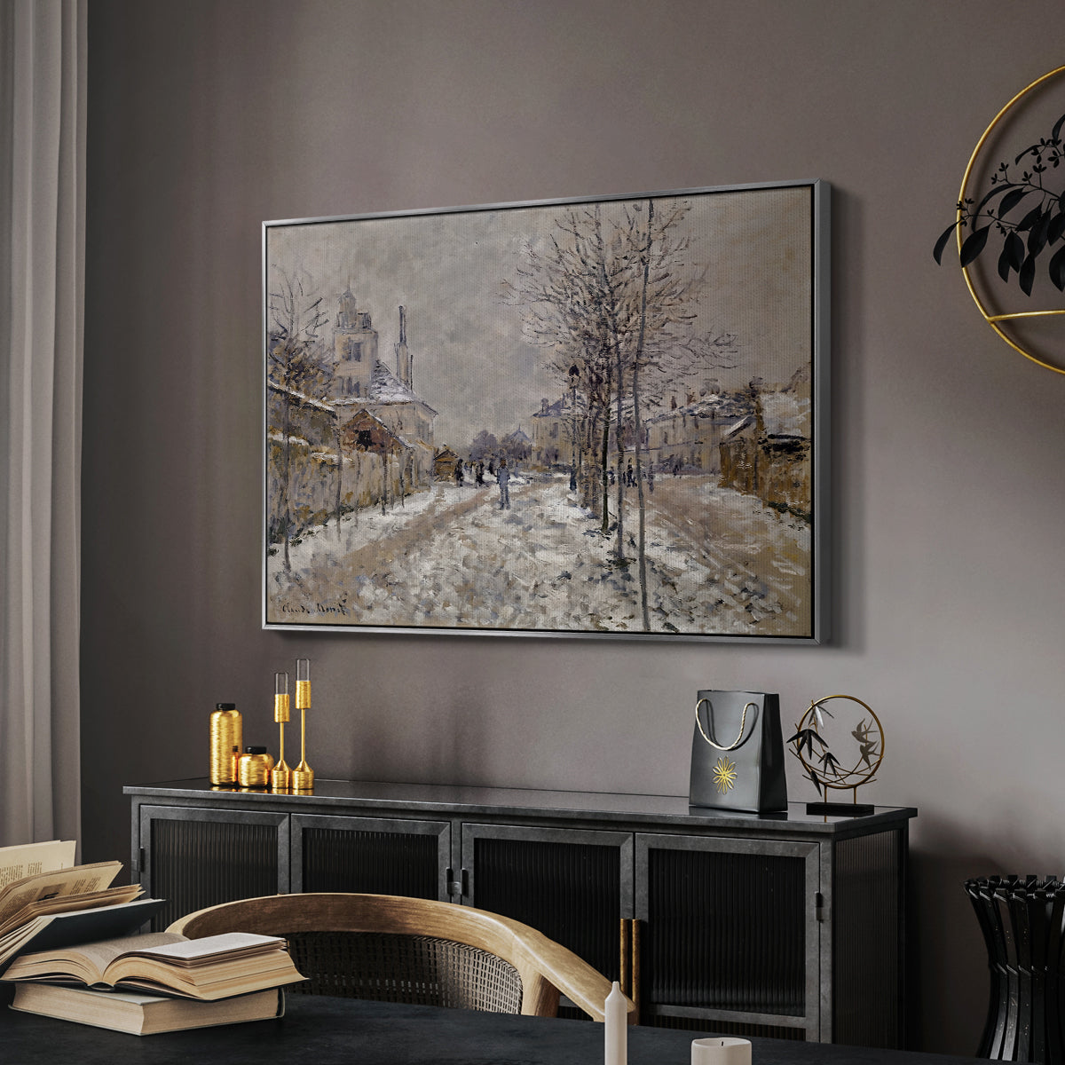 The Boulevard de Pontoise at Argenteuil, Snow Effect, 1875 by Claude Monet in a silver floater framed canvas featuring a quiet boulevard blanketed in snow with distant figures, displayed above a desk in a dark home office interior.