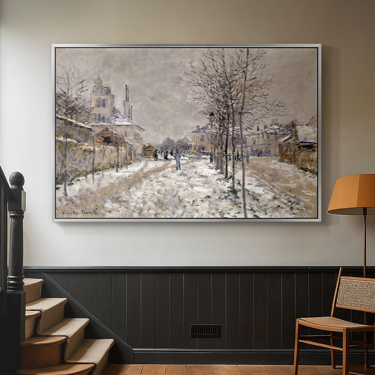 Silver floater framed canvas featuring an urban winter landscape with muted tones and soft light, displayed in a hallway near a staircase.