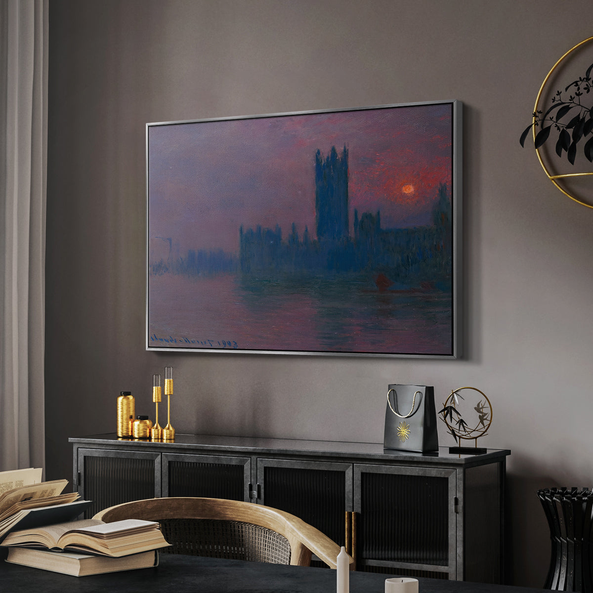 The Houses of Parliament, Sunset, 1903 by Claude Monet in a silver floater framed canvas featuring an atmospheric London scene with buildings fading into haze, displayed above a desk in a dark home office interior.
