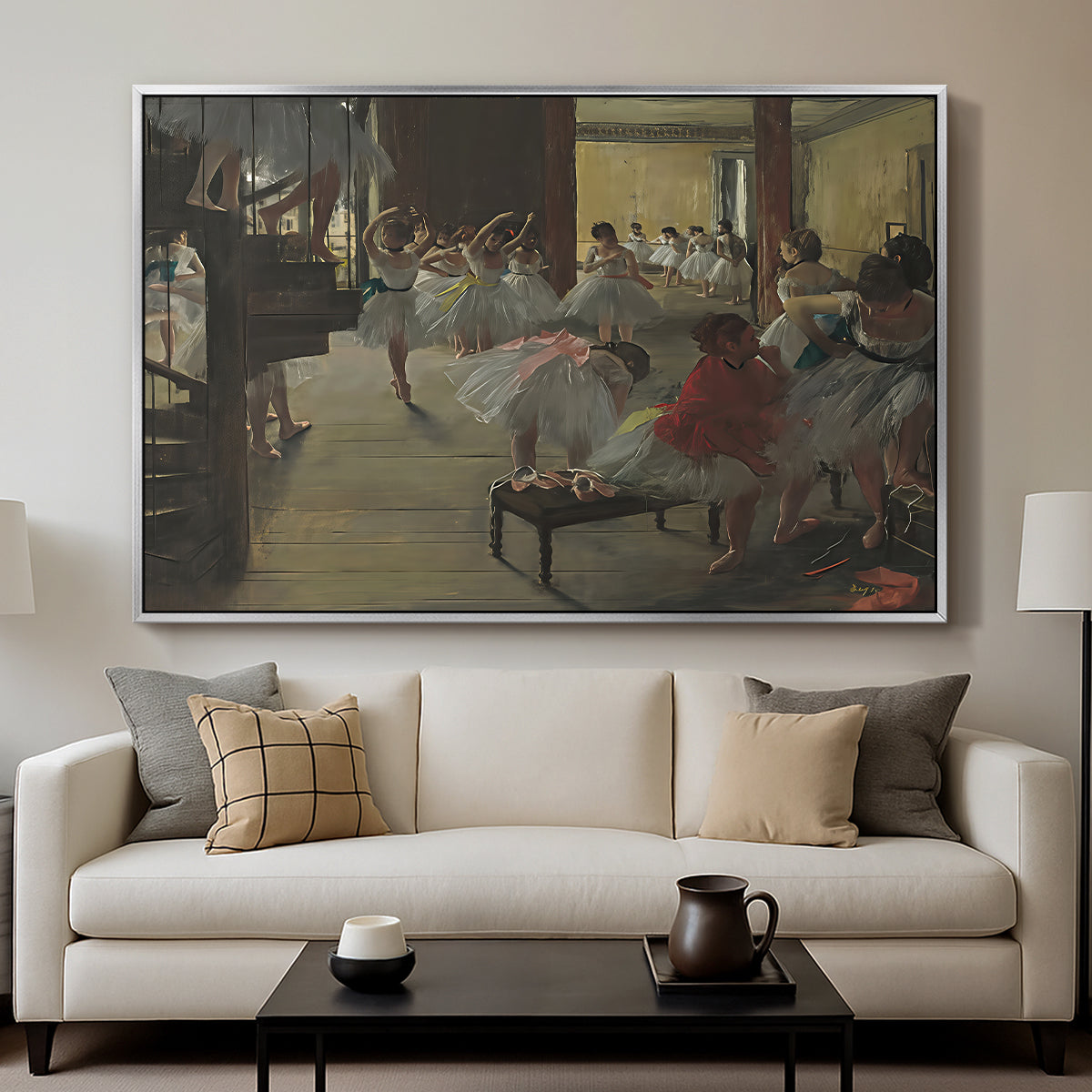 The Dance Class, c. 1873 by Edgar Degas displayed in a silver floater framed canvas above a sofa in a clean living room.