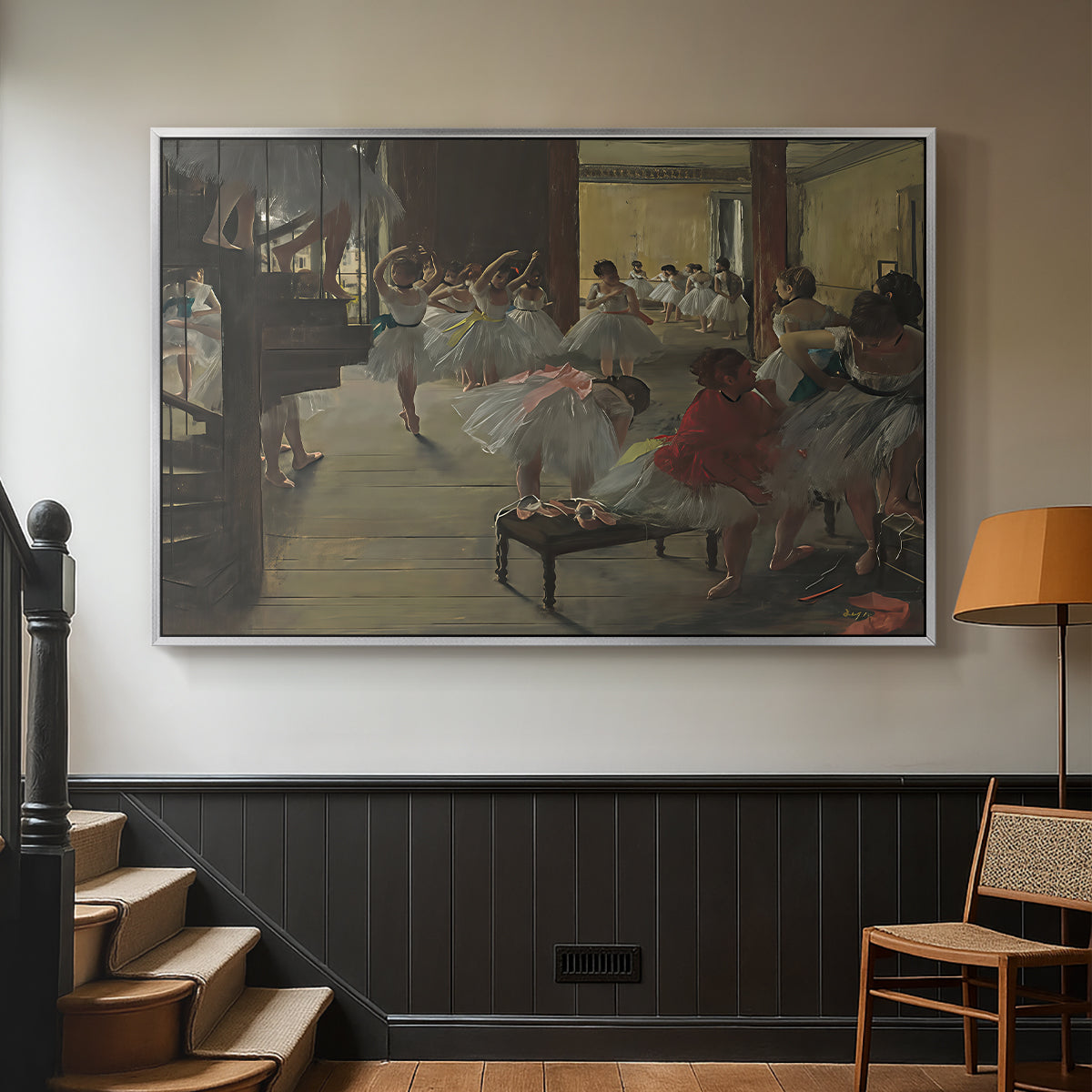 Silver floater framed canvas featuring a group of dancers preparing during class with natural light, displayed in a hallway near a staircase.