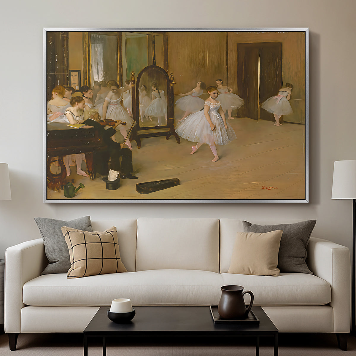 The Dancing Class, c. 1870 by Edgar Degas displayed in a silver floater framed canvas above a sofa in a clean living room.
