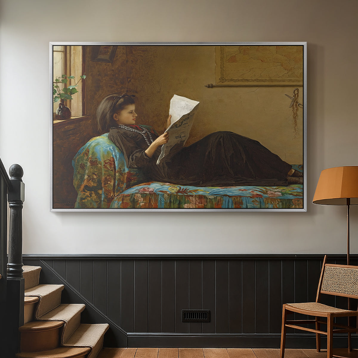 Silver floater framed canvas featuring a casual gathering around newspaper in rustic room, displayed in a hallway near a staircase.