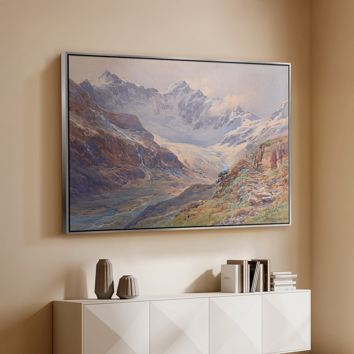 Silver floater framed canvas of Odenwinklkees with the Johannisberg, 1902 by Edward Theodore Compton, featuring a mountain scene with glacier stretching through rocky valley above a console cabinet in a minimalist entryway.