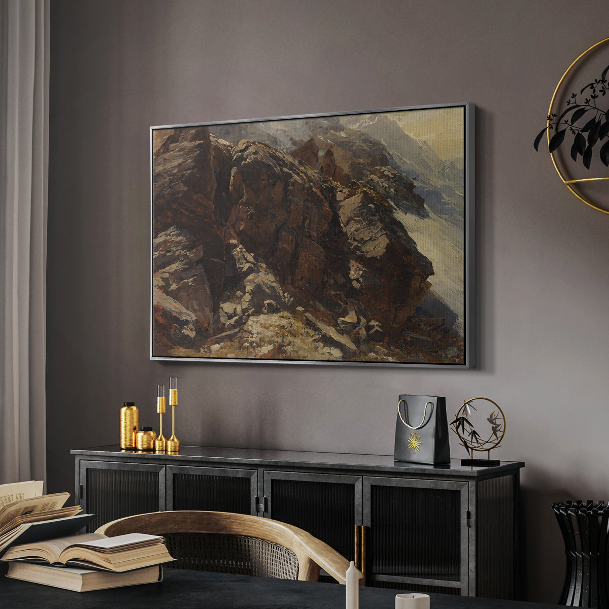High Mountain Study, c. 1870 by Edward Theodore Compton in a silver floater framed canvas featuring a high-altitude scene with rocky formations and sparse vegetation, displayed above a desk in a dark home office interior.