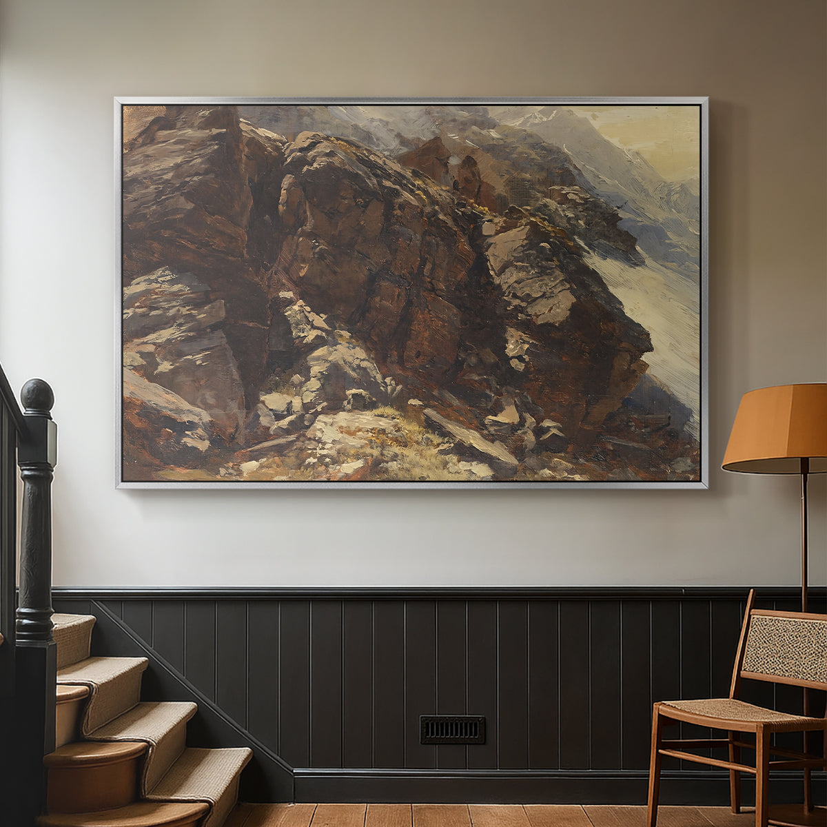 Silver floater framed canvas featuring a realistic depiction of mountainous terrain under open sky, displayed in a hallway near a staircase.