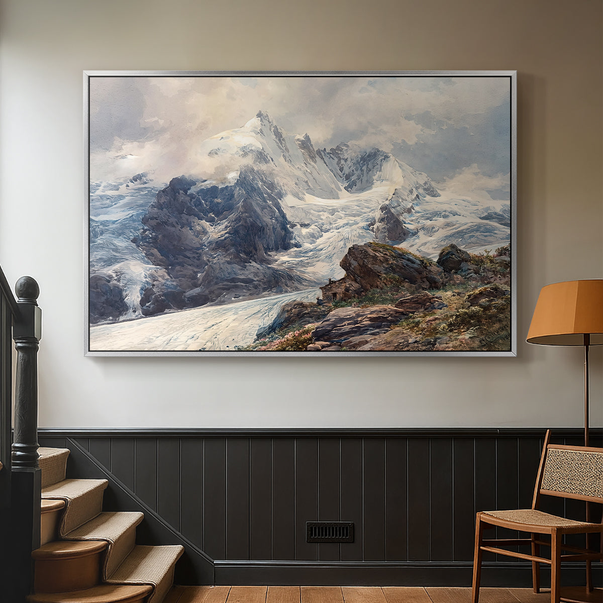 Silver floater framed canvas featuring an alpine peak dominating surrounding terrain, displayed in a hallway near a staircase.