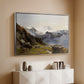 Silver floater framed canvas of The Großglockner from the Prager Hut, 1890 by Edward Theodore Compton, featuring a mountain summit seen from elevated viewpoint with surrounding landscape above a console cabinet in a minimalist entryway.