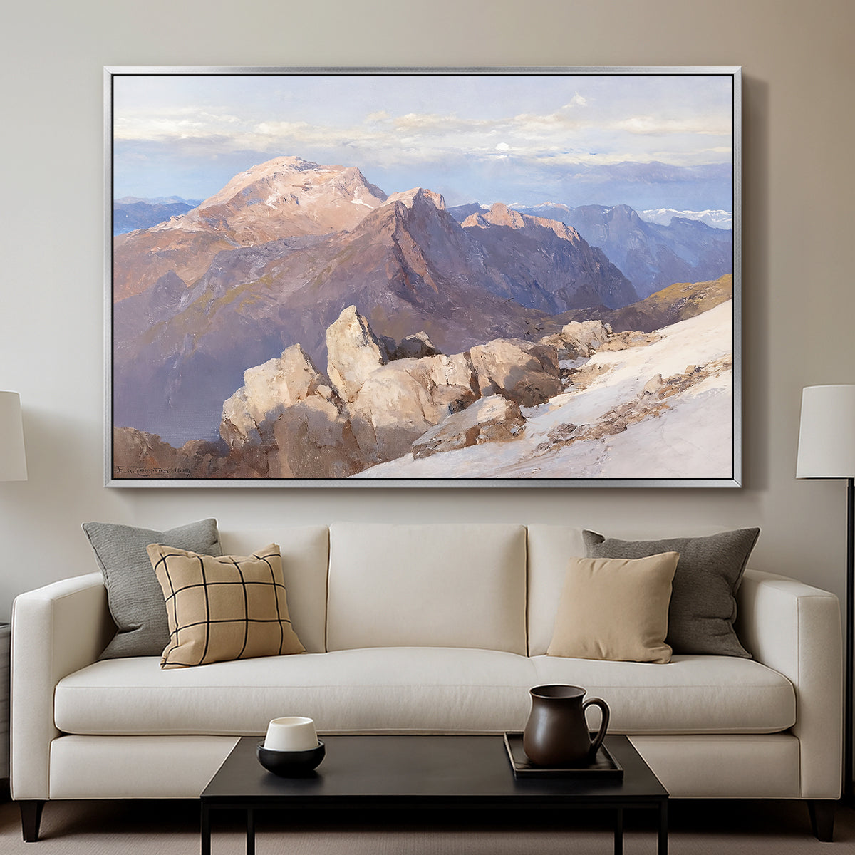 Hoher Göll from Watzmann-Hocheck, 1919 by Edward Theodore Compton displayed in a silver floater framed canvas above a sofa in a clean living room.