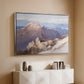 Silver floater framed canvas of Hoher Göll from Watzmann-Hocheck, 1919 by Edward Theodore Compton, featuring an alpine panorama showing layered peaks and valleys above a console cabinet in a minimalist entryway.