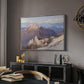 Hoher Göll from Watzmann-Hocheck, 1919 by Edward Theodore Compton in a silver floater framed canvas featuring a high vantage point overlooking rugged mountain terrain, displayed above a desk in a dark home office interior.