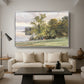Landscape at Lake Starnberg, 1890 by Edward Theodore Compton as a silver floater framed canvas featuring a lakeside landscape with calm water and trees along shoreline, displayed above a sofa in a modern living room.