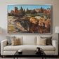 Palatine in Rome, c. 1921 by Edward Theodore Compton displayed in a silver floater framed canvas above a sofa in a clean living room.