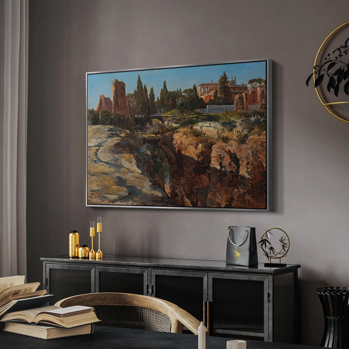 Palatine in Rome, c. 1921 by Edward Theodore Compton in a silver floater framed canvas featuring a cityscape with classical ruins and surrounding terrain, displayed above a desk in a dark home office interior.