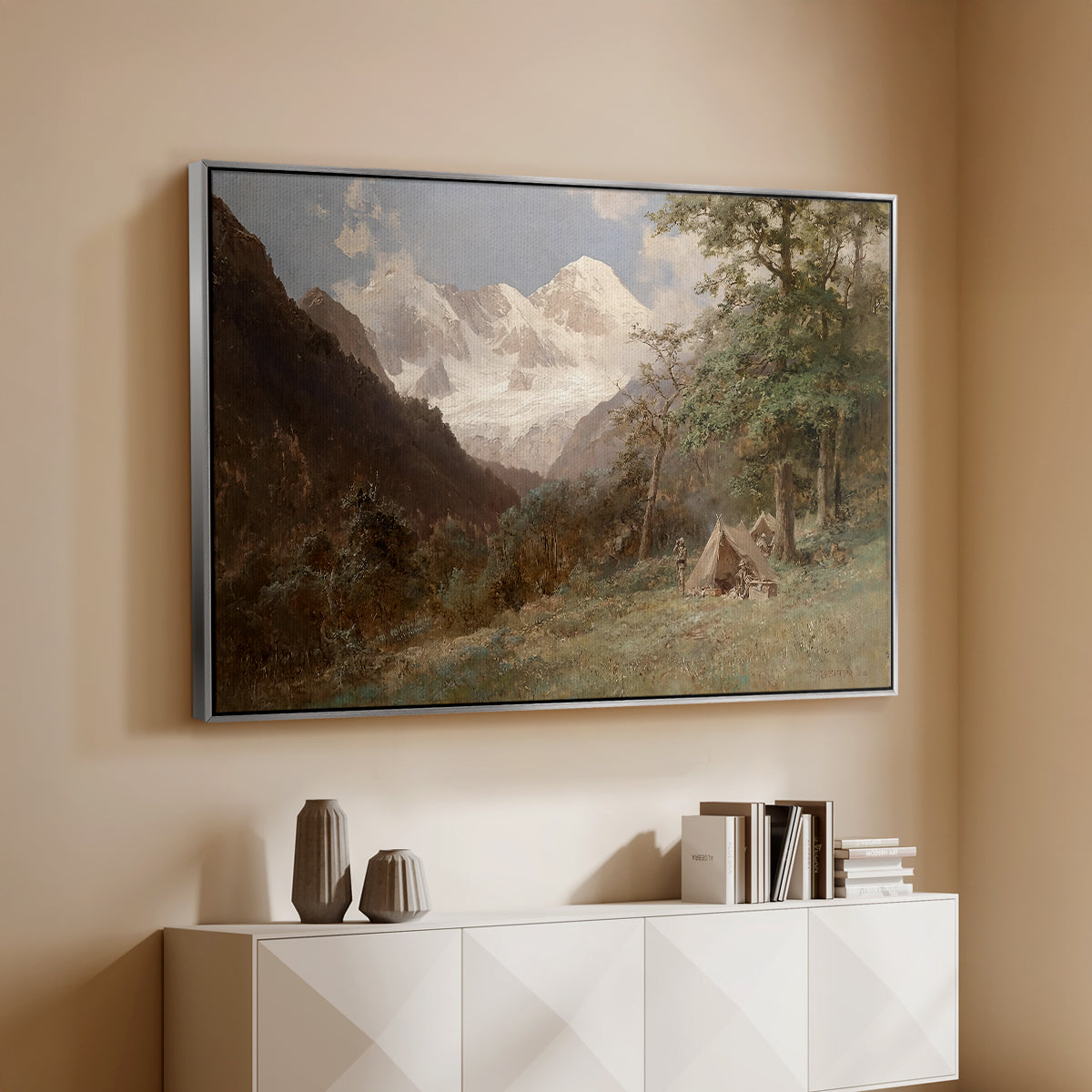 Silver floater framed canvas of Landscape in the Caucasus, c. 1921 by Edward Theodore Compton, featuring an expansive view of Caucasus mountains under open sky above a console cabinet in a minimalist entryway.