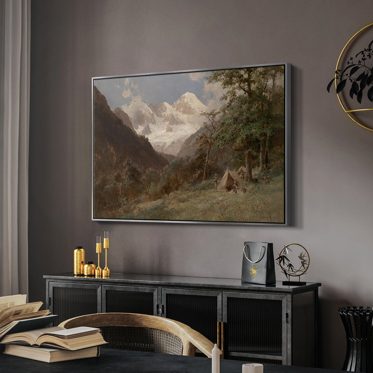 Landscape in the Caucasus, c. 1921 by Edward Theodore Compton in a silver floater framed canvas featuring a natural scene with valleys and rocky formations, displayed above a desk in a dark home office interior.