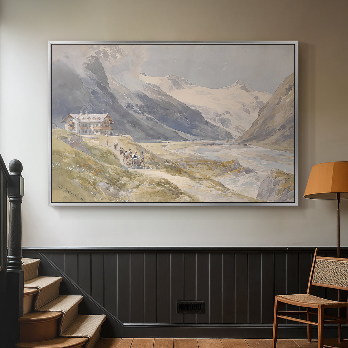 Silver floater framed canvas featuring a natural landscape with human presence among mountains, displayed in a hallway near a staircase.