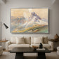 From the Dolomites, 1904 by Edward Theodore Compton as a silver floater framed canvas featuring dramatic Dolomite mountain peaks rising above rugged terrain, displayed above a sofa in a modern living room.