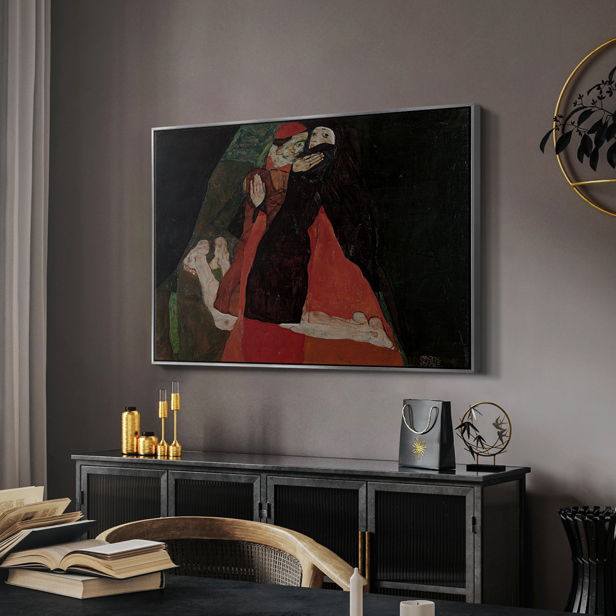 Cardinal and Nun (Caress), 1912 by Egon Schiele in a silver floater framed canvas featuring an expressive painting of figures entwined with bold lines and color, displayed above a desk in a dark home office interior.