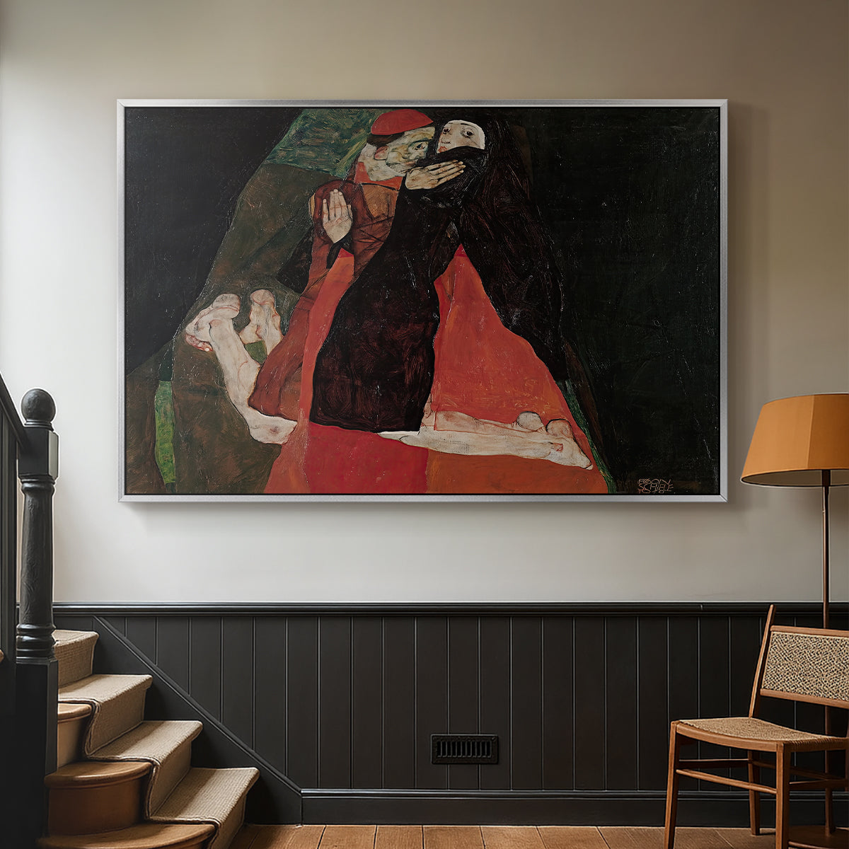 Silver floater framed canvas featuring an intimate scene with religious figures in modernist style, displayed in a hallway near a staircase.