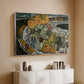 Silver floater framed canvas of Crescent of Houses II (Island Town), 1915 by Egon Schiele, featuring a stylized townscape with clustered buildings and bold outlines above a console cabinet in a minimalist entryway.
