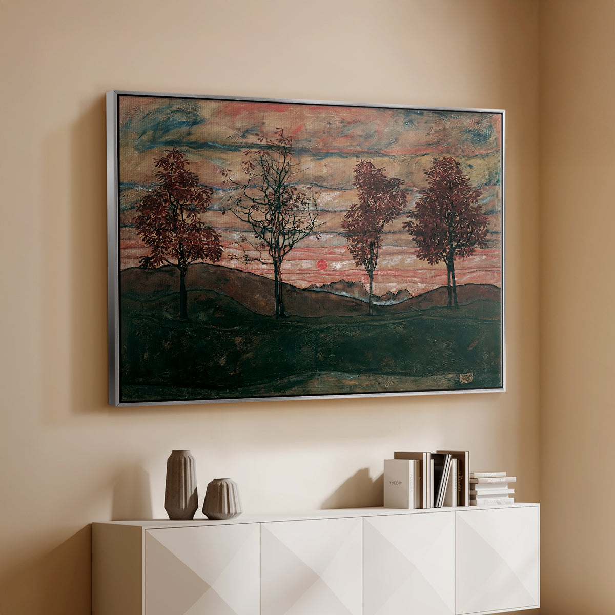 Silver floater framed canvas of Four Trees, 1917 by Egon Schiele, featuring a minimal landscape with grouped trees and expressive color above a console cabinet in a minimalist entryway.