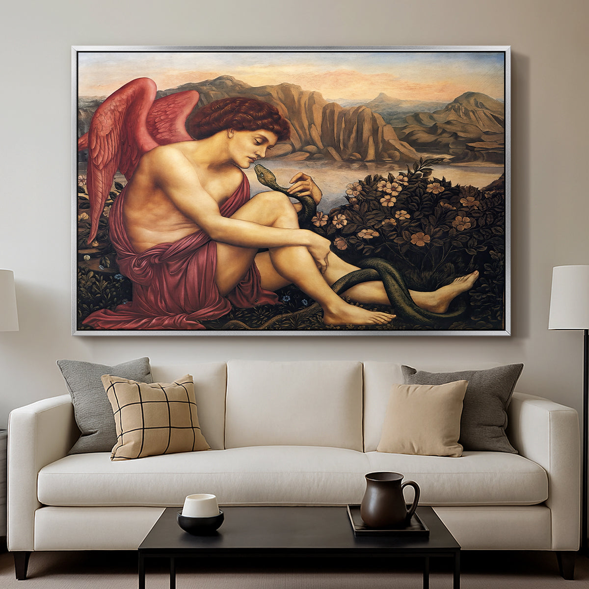 The Angel with the Serpent, c. 1870-1875 by Evelyn De Morgan displayed in a silver floater framed canvas above a sofa in a clean living room.