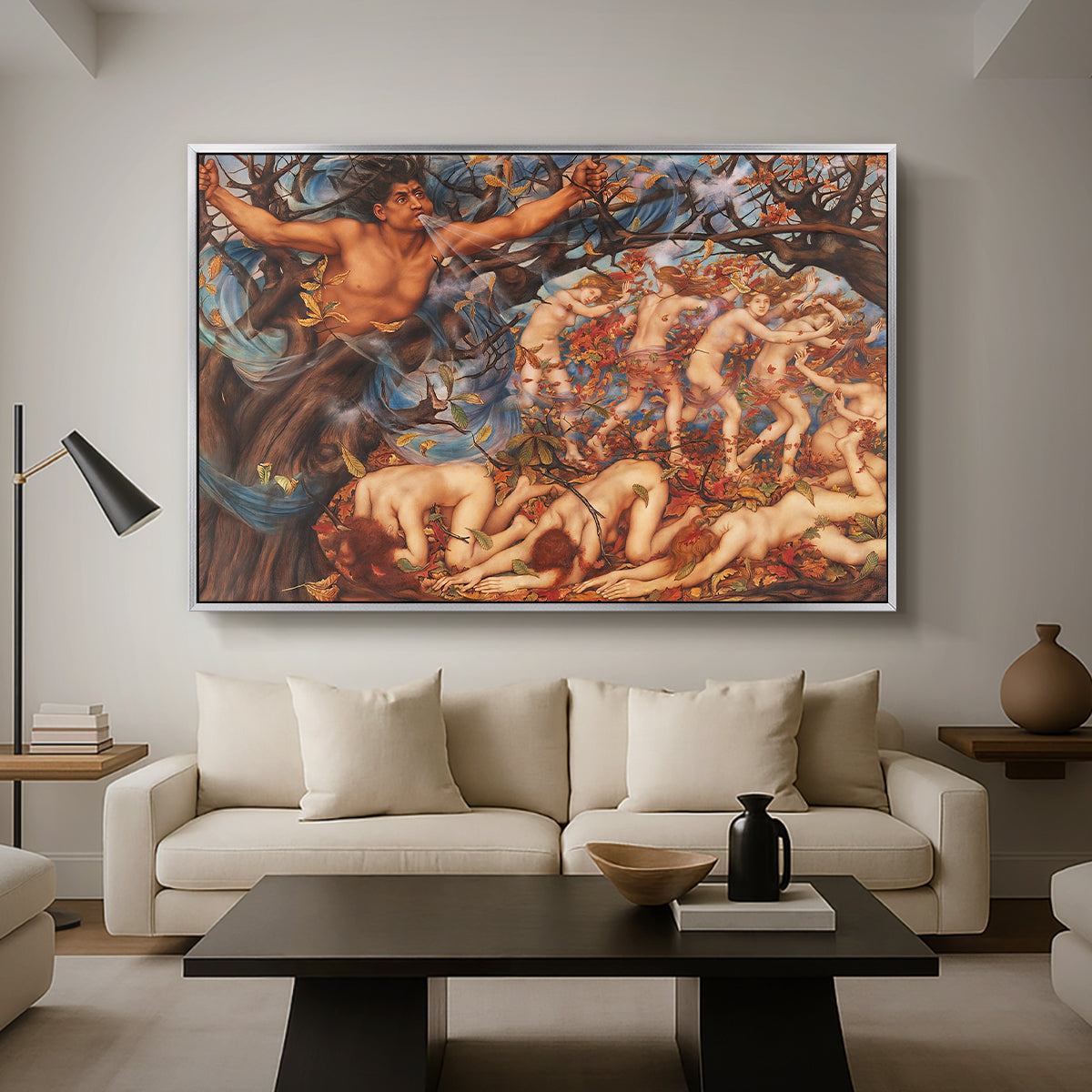 Boreas and the Fallen Leaves, c. 1910-1914 by Evelyn De Morgan as a silver floater framed canvas featuring swirling figures carried by wind among falling leaves in dynamic composition, displayed above a sofa in a modern living room.