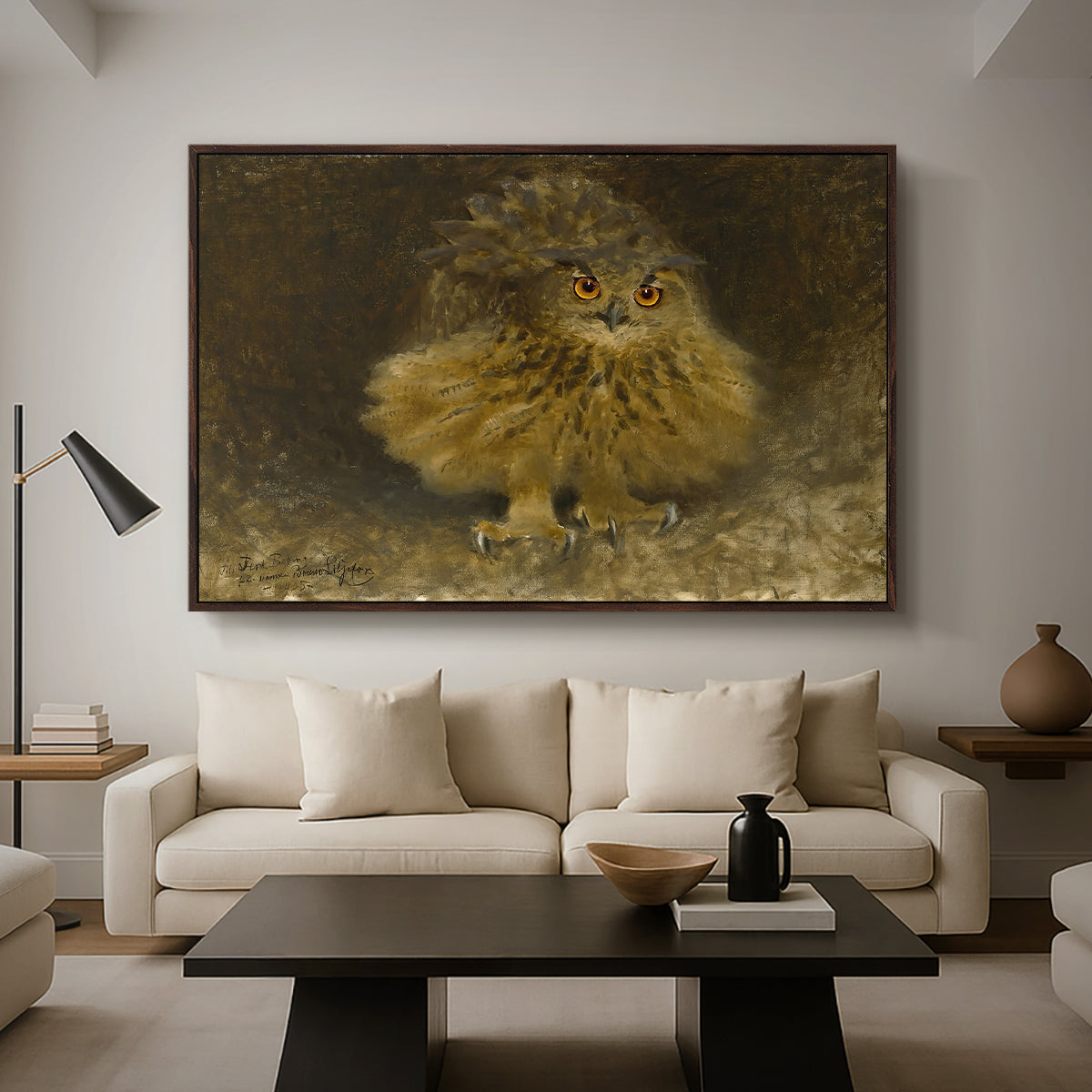 An Eagle Owl (Berguv), 1905 by Bruno Liljefors as a walnut floater framed canvas featuring a large owl perched on branch in shadowy natural forest setting, displayed above a sofa in a modern living room.