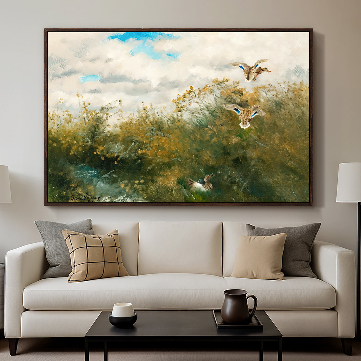 Wild Ducks (Grasänder), 1890 by Bruno Liljefors displayed in a walnut floater framed canvas above a sofa in a clean living room.