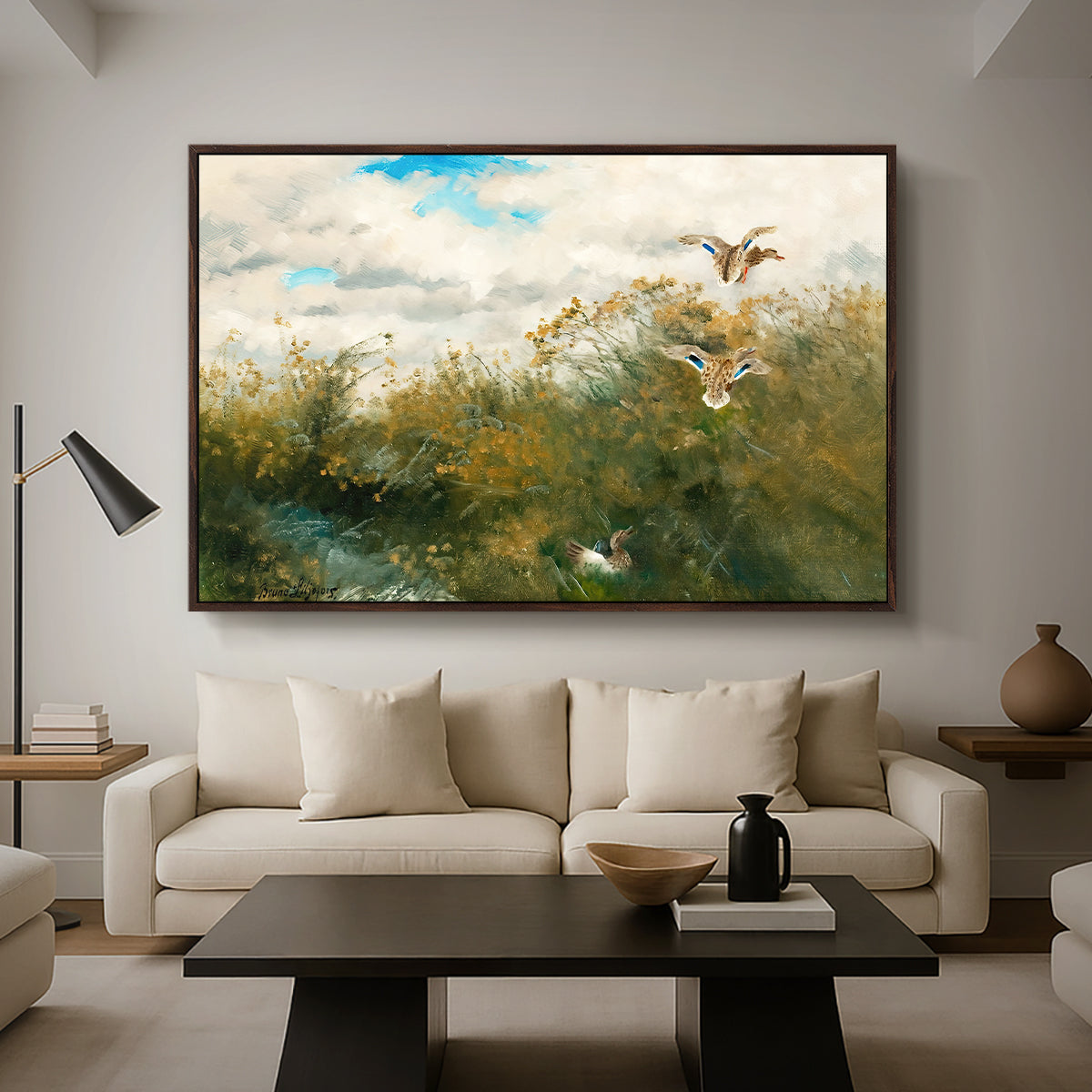 Wild Ducks (Grasänder), 1890 by Bruno Liljefors as a walnut floater framed canvas featuring ducks moving through grassy wetland near water's edge, displayed above a sofa in a modern living room.