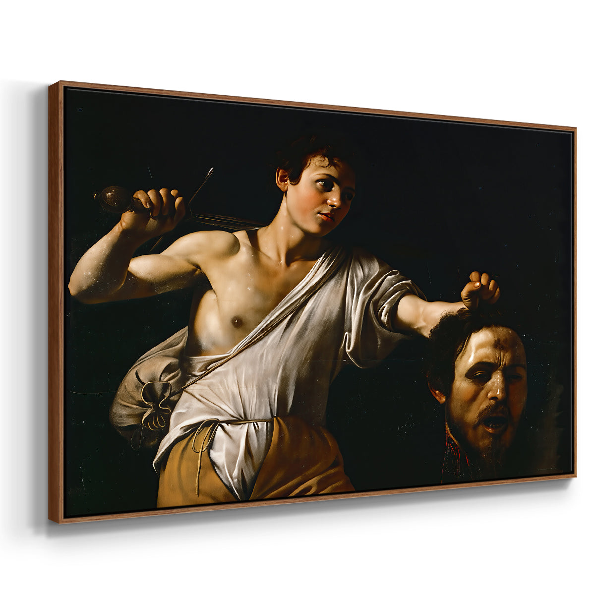 Angled view of David with the Head of Goliath (Vienna Version), c. 1607 by Caravaggio in a walnut floater framed canvas.
