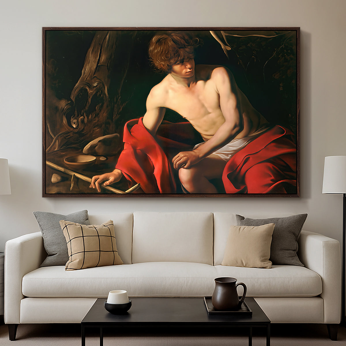 Saint John the Baptist in the Wilderness, c. 1603-1604 by Caravaggio displayed in a walnut floater framed canvas above a sofa in a clean living room.