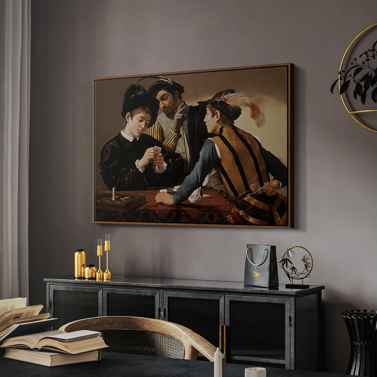 The Cardsharps, c. 1594 by Caravaggio in a walnut floater framed canvas featuring a young men playing cards with one cheating and another watching closely, displayed above a desk in a dark home office interior.