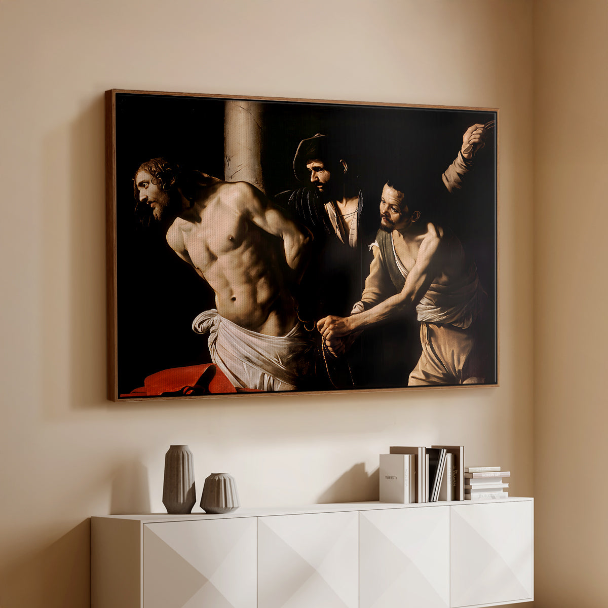 Walnut floater framed canvas of The Flagellation of Christ at the Column (Rouen Version), 1606 by Caravaggio, featuring a dramatic religious scene of Christ enduring flagellation in dark interior above a console cabinet in a minimalist entryway.