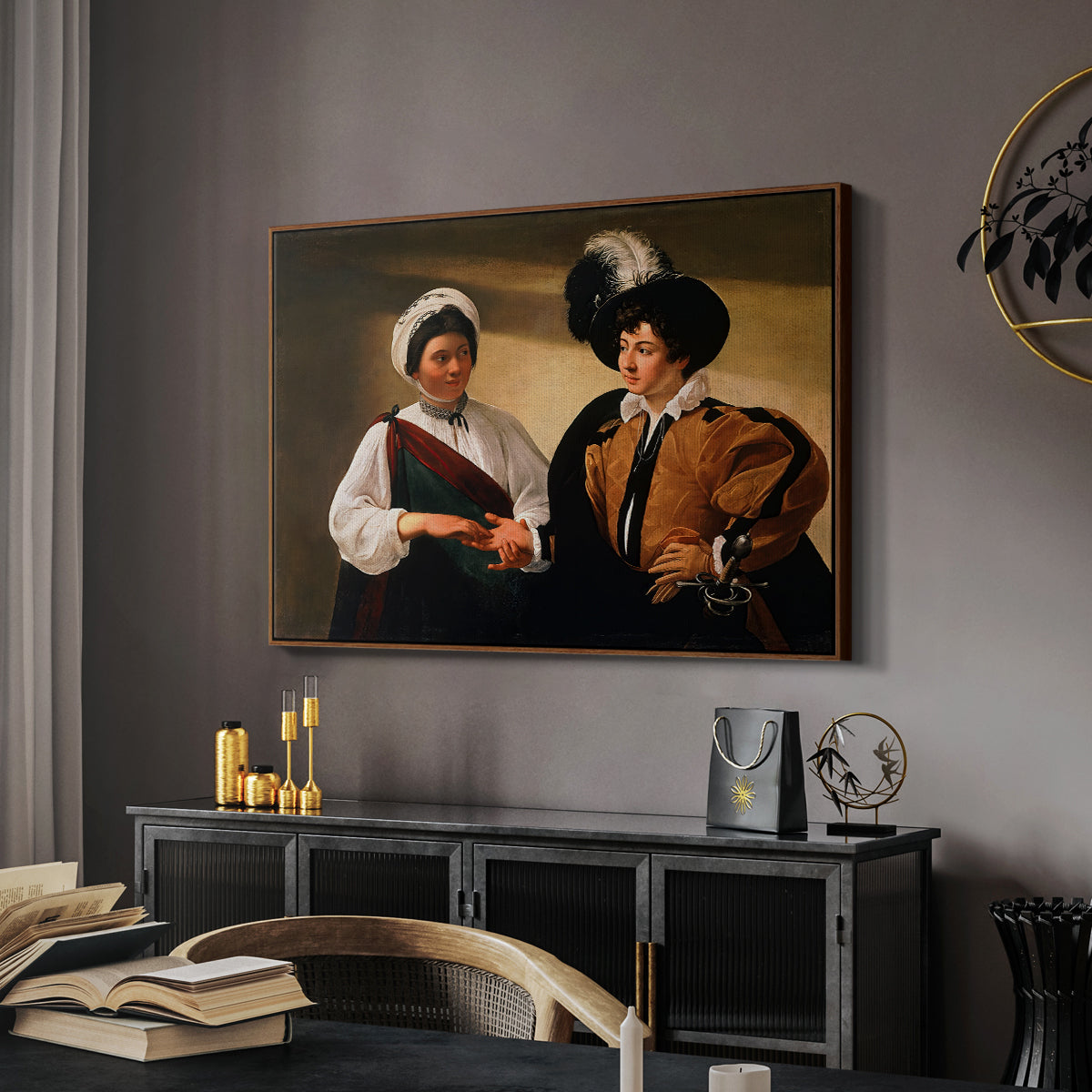 The Fortune Teller (Louvre Version), c. 1595 by Caravaggio in a walnut floater framed canvas featuring an intimate scene of palm reading with subtle act of theft, displayed above a desk in a dark home office interior.