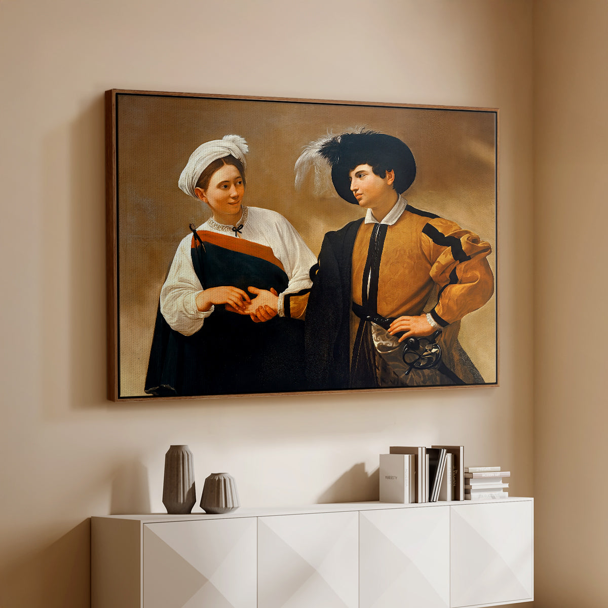 Walnut floater framed canvas of The Fortune Teller (Capitoline Version), c. 1599 by Caravaggio, featuring a fortune teller tricking young man during palm reading above a console cabinet in a minimalist entryway.